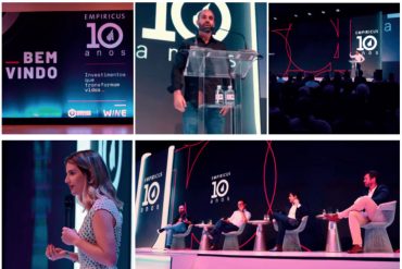 Homem sorrindo, olhando para gráficos de crescimento financeiro em uma tela de computador, com um livro sobre investimentos ao lado.